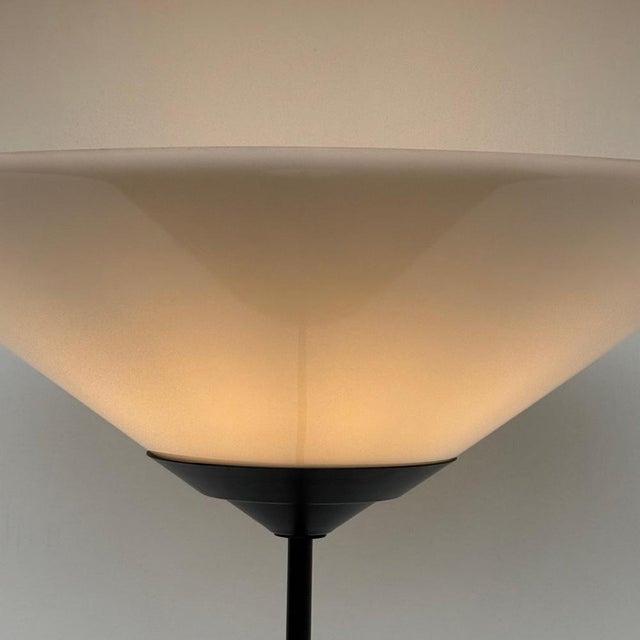 The lamp appears to be an anonymous or manufacturer attributed postmodern uplighter from the 1990s, likely Italian or...