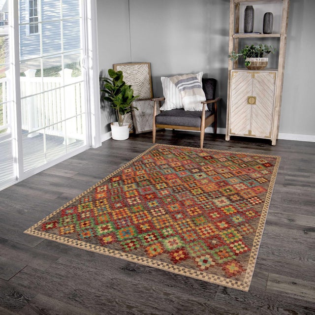 This stunning hand-knotted Afghan Balouchi rug is a captivating addition to any decor. Crafted by skilled artisans, it...