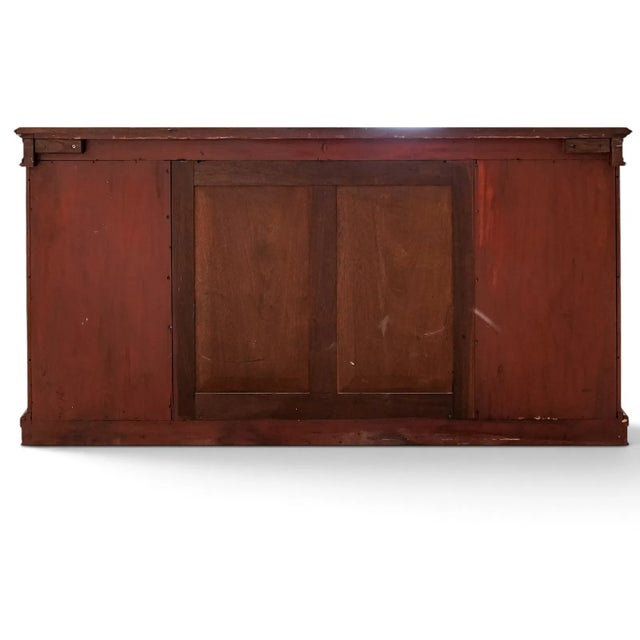 French Napoleon III style credenza featuring elaborate marquetry paneling, ebonized and giltwood architectural detailing,...