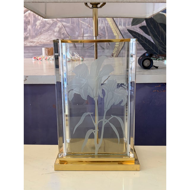 Vintage Frederick Raymond lucite lamps with an etched lily motif, brass accents, and a crisp rectangular shade. Clean...