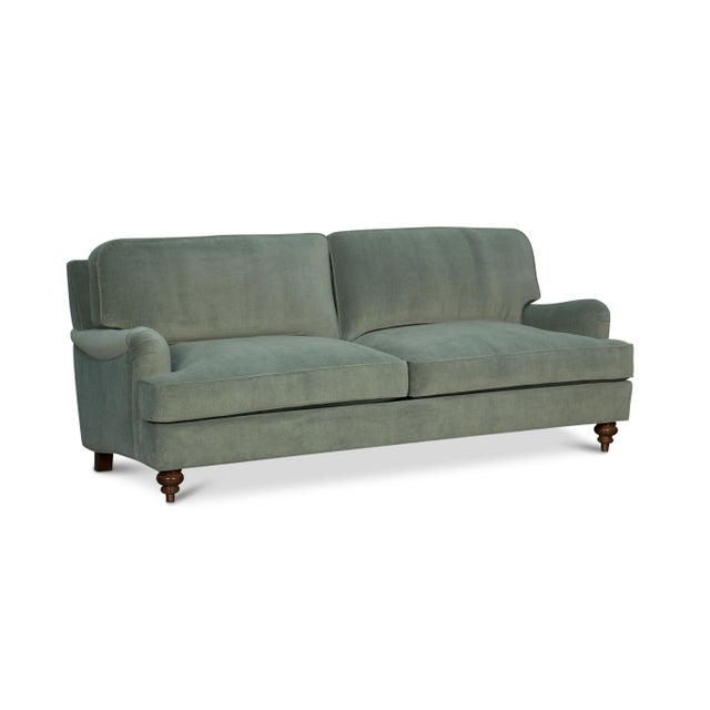 Timeless style meets luxurious comfort in this high-end English Roll Arm sofa. Upholstered in 100% cotton velvet with a...