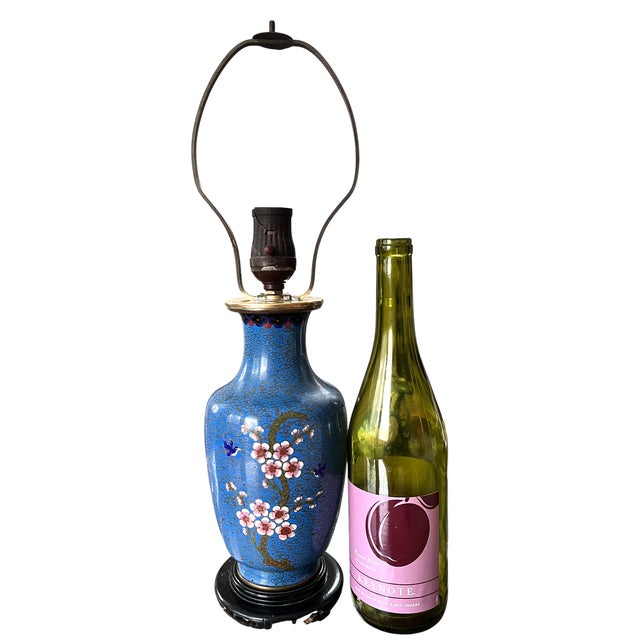 A striking antique Chinese cloisonné vase converted into a table lamp, featuring delicate cherry blossom branches and...