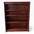 A classic mid-century Danish teak bookcase, showcasing the clean lines and understated elegance typical of Scandinavian...