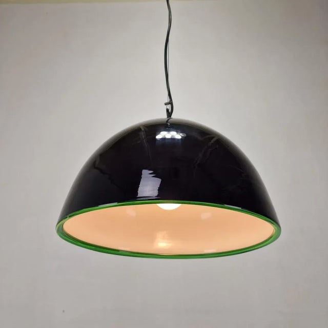 Exceptional and rare pendant designed by Gae Aulenti for Vistosi from the "Neverino" series. Hand blown Murano dark purple...