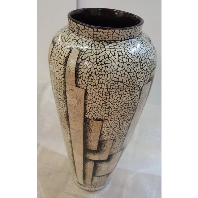 Black and Cream color eggshell vase. Very light. Black Lacquer on the inside. Very light weight vase. Seems to be made on...