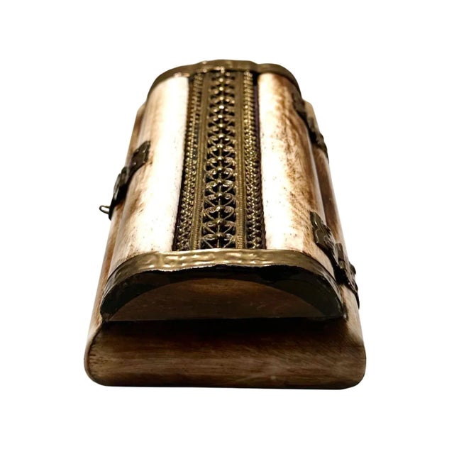 Fabulous Indian box made of bone and pierced brass with a wood bottom. A very nice design. Turn of the century, India.
