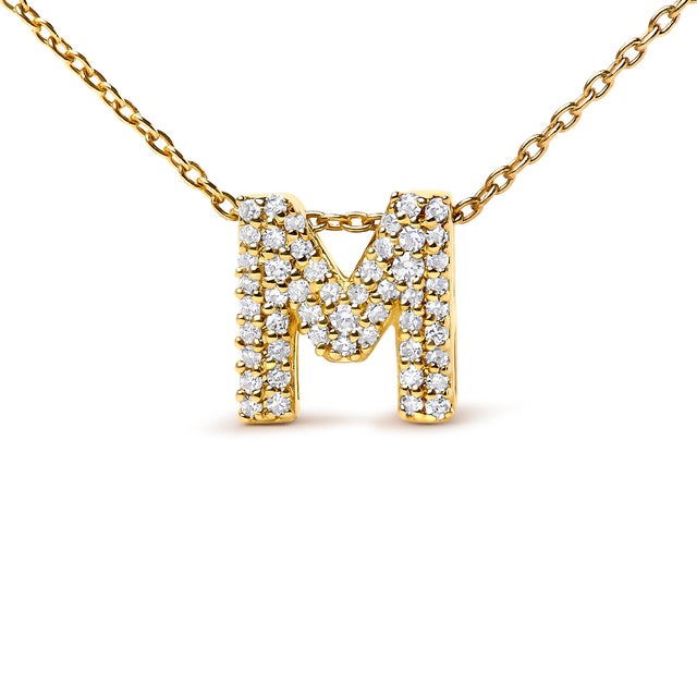 Elegance meets personalized charm in this exquisite pendant, meticulously crafted from radiant 10K yellow gold enhances...