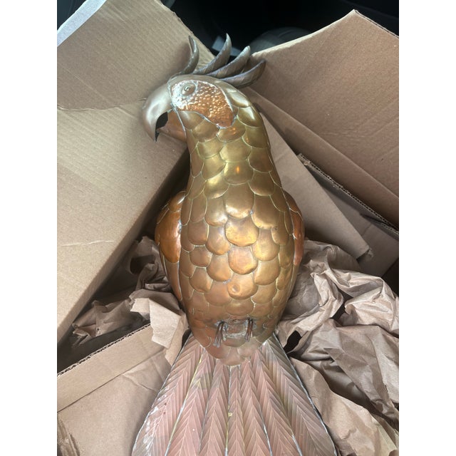 Closely resembling the mid-20th-century decorative parrot sculpture created by renowned Mexican artist Sergio Bustamante...