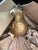 Closely resembling the mid-20th-century decorative parrot sculpture created by renowned Mexican artist Sergio Bustamante...