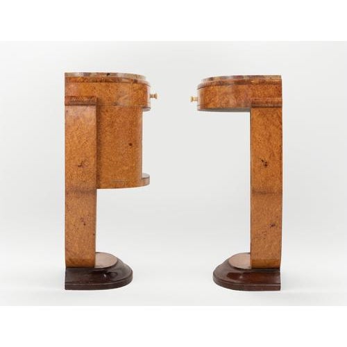 A splendid pair of Art Dèco bedside tables realized by Jules Leleu in 1923. Amboyna burl veneer, Breccia marble tops, and...