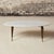 Add refined mid-century elegance to your space with this 1950s French marble top coffee table, a beautifully balanced...