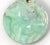 This jadeite jade apple green 30mm. pendant features a carved horse design, representing one of the twelve animals in the...