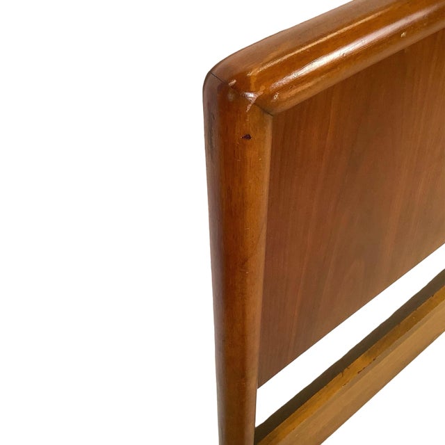 Elevate your bedroom suite with this striking mid-century modern full-size headboard, heavily channeling the minimalist...