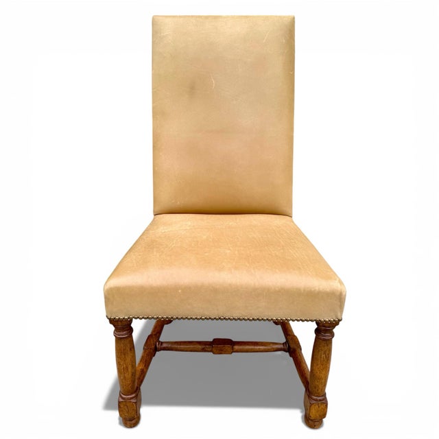 A set of Louis XIII dining chairs from legendary Rose Tarlow Melrose House. Handmade in Los Angeles, the chairs are made...