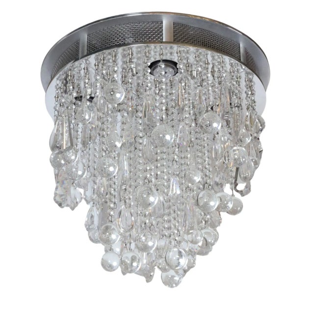 This Modern style flush mount chandelier was designed for the Waldorf Astoria 19th floor spa by Todd Rugee. It features...