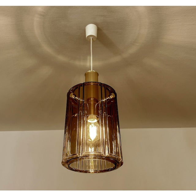 Pair of Vintage Limburg Pendant Light, tint glass shades mounted on a brass structure , large brass finial and knoby glass...