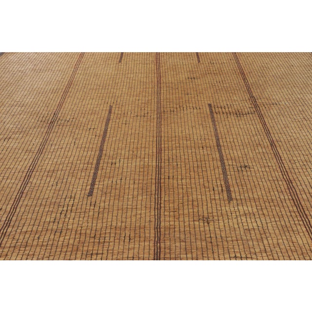 Made with handwoven reed and camel leather in Mauritania circa 1950-1960, this 9x17 vintage Tuarage mat is an exceptional...