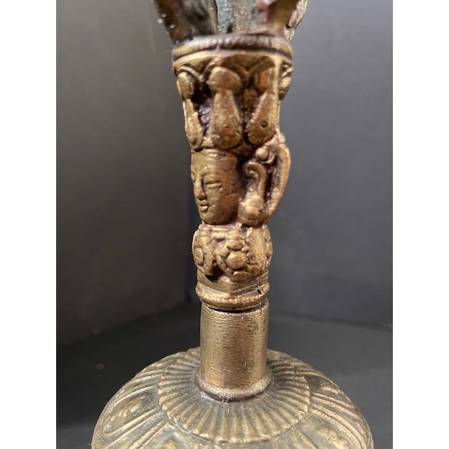 Tibetan Buddhist bells (ghanta) are ritual objects symbolizing wisdom. This one, while not terribly old, is heavy and well...