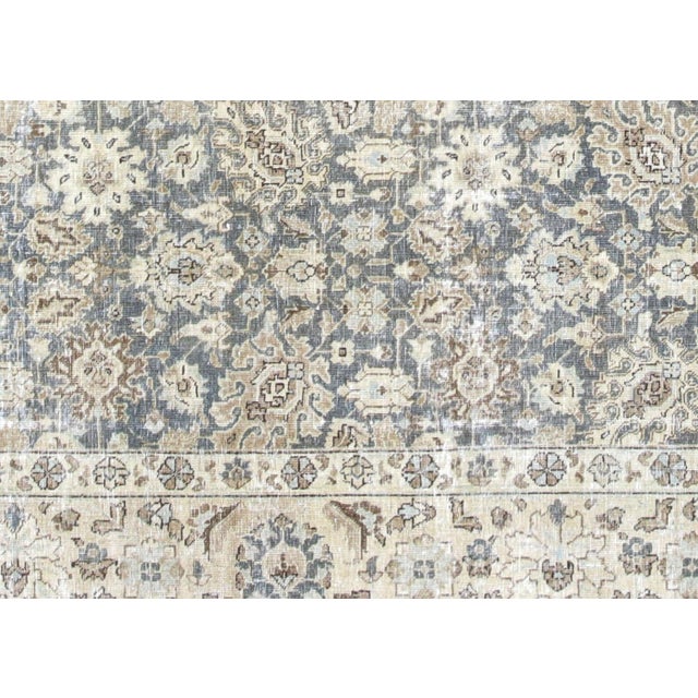 This semi-antique Persian Tabriz rug showcases the distinguished weaving heritage of Northern Iran's most celebrated rug-...