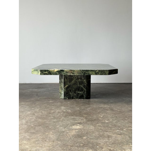 Crafted entirely from richly veined Verde Alpi marble, this vintage coffee table pairs monumental proportions with the...