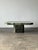 Crafted entirely from richly veined Verde Alpi marble, this vintage coffee table pairs monumental proportions with the...