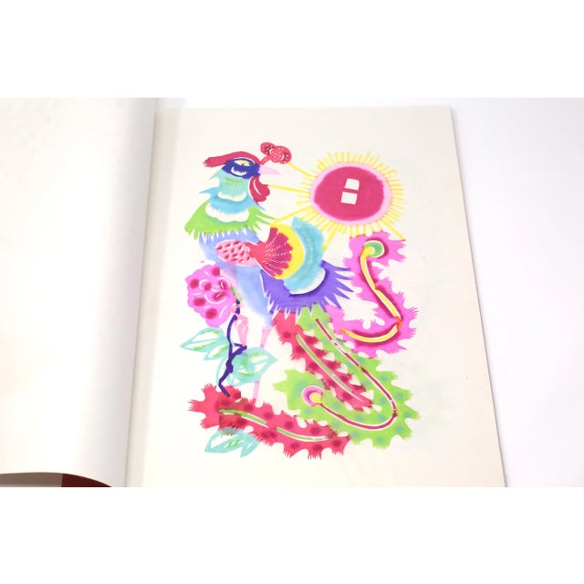 A set of eight vintage, handmade and hand-colored paper cuttings, each depicting a stylized, colorful bird and flowers....