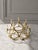 An exceptional mid-century modern ten-light candelabra crafted from solid brass and composed of five circular elements...