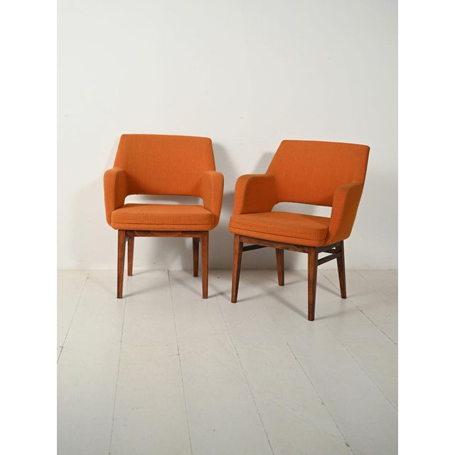 Pair of Oslosund armchairs by Kinnarps, 1950s, teak frame and original orange upholstery. Elegant pair of Oslosund...