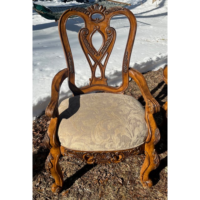 A set of wonderful, lavish French Rococo style arm chairs by Schinadig Furniture Corp. These four arm chairs have...