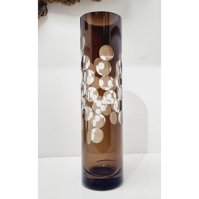 This striking vintage cylinder vase is a sophisticated example of Mid-Century Modern glass artistry, likely originating...