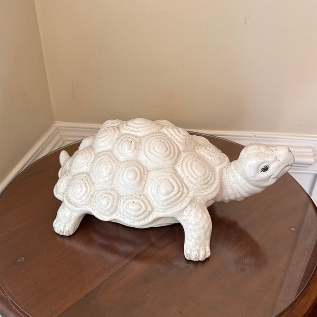 Add a touch of elegant Italian design and whimsical charm to your home with this vintage white ceramic turtle sculpture....