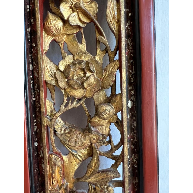 This pair of Chinese wall panels feature intricate openwork carvings, depicting auspicious symbols like birds and flowers....