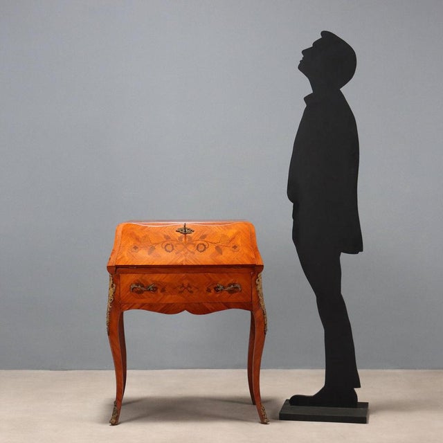 Late Baroque-style rosewood drop-leaf chest of drawers with floral and leaf inlays in various woods. Drop-leaf top with...