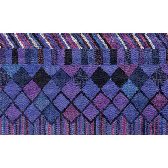 This exquisite vintage Swedish flat-weave rug, designed by the legendary Märta Måås-Fjetterström and crafted by AB MMF, is...