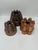 This is a highly distinctive group of antique copper culinary molds, unified by architectural form, repetition, and...