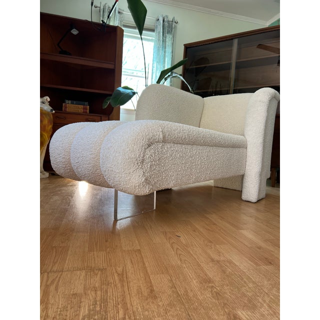 Stunning, sculptural white bouclé sofa with a bold, cloud-like design. This eye-catching piece features soft, textured...