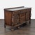 This vintage sideboard features detailed carved designs and a rich wood finish. It offers plenty of storage with two large...