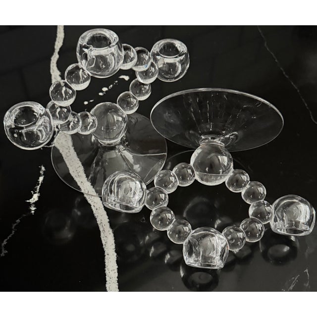 Sculptural beaded crystal candle holders with modern Woodward roots. Clear, substantial crystal with a balanced,...