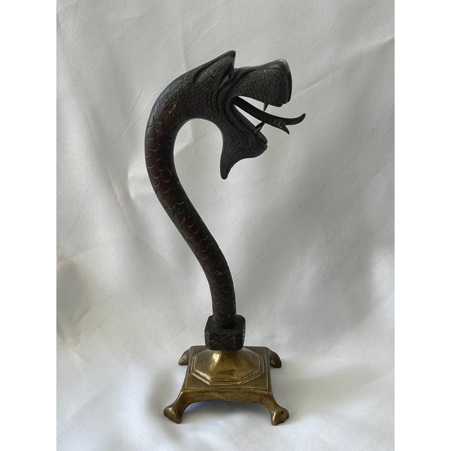 This stylish English Dragon revival watch holder dates to the early part of the 20th century and is fabricated in cast...