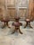 Three legged tractor style seated stools in the style of Adolf Loos. The seats are sculpted of one piece of mahogany.