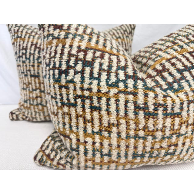 Custom pair of 16"x20" pillows covered in Osborne & Little "Caraballo Zemu" in cream/spice boucle fabric. These pillows...