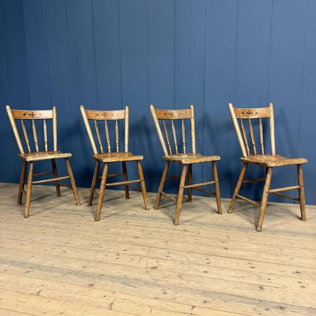 Beautiful set of four painted Dutch kitchen chairs from 1928. These chairs were made in the Brabant village of Oirschot in...