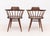 Pair of George Nakashima (American, 1905-1990) American Walnut Captain's Armchairs, 1962, with spindle backs on turned...