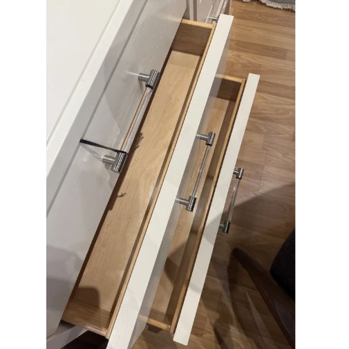 This is a chic white nightstand showcases smooth gloss finish and trendy acrylic horizontal bars. It's generous storage...