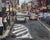 Roadway by Jim Beckner | Oil on Board Urban street scene with cars and pedestrians. For Sale