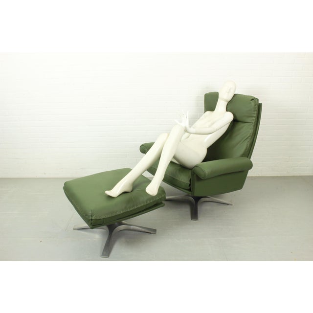 Acquire a true masterpiece of mid-century luxury with this iconic De Sede DS-31 high-back lounge chair and matching...