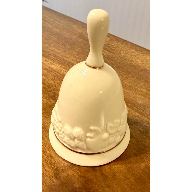 This creamy white porcelain decorative bell from the Lenox ‘Fruits of Life’ collection. It features an intricately...