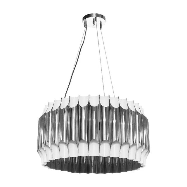 Galliano round chandelier is a mid-century modern light with a shape that was inspired by a pipe organ. This modern...