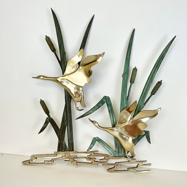 This is a stunning Mid-Century Brass and Verdigris Bronze Wall Sculpture. The artist featured two polished brass ducks in-...