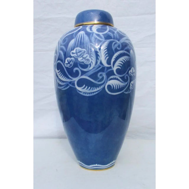 Collectors Sevres lidded jar in dark blue with art deco floral designs over shoulders. Studio artwork and unique....